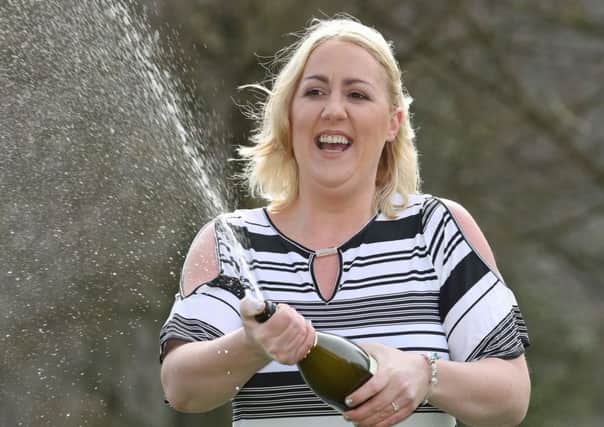 Mother of four Beverley Doran, 37, from West Yorkshire, celebrates at the Hollins Hall Marriott Hotel & Country Club in Bradford