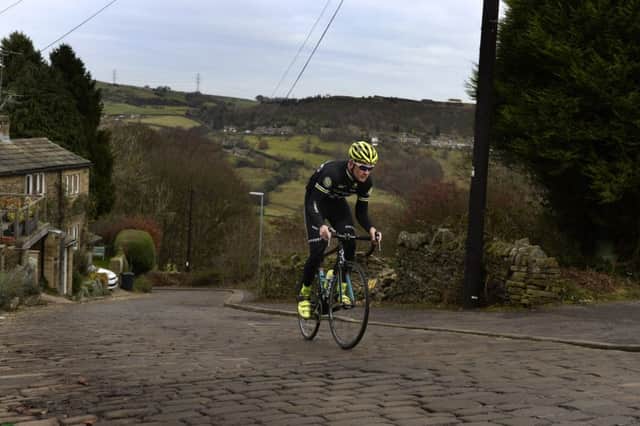 Local cyclist Matt Denby tackles the 15% cobbles of Shibden Wall which will feature in the 3rd and final stage of the 2017 Tour de Yorkshire