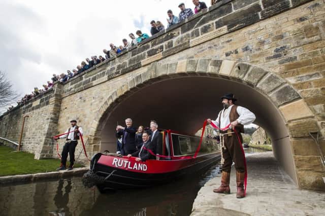 Official re-opening of Elland Bridge. Transport minister Andrew Jones cuts the ribbon