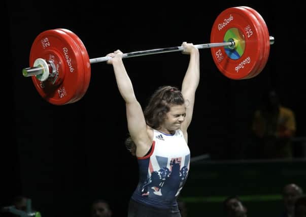 Rebekah Tiler, of Great Britain, competes in the women's 69kg weightlifting competition at the 2016 Summer Olympics in Rio de Janeiro, Brazil, Wednesday, Aug. 10, 2016. (AP Photo/Mike Groll)