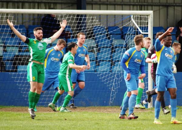 Radcliffe v Brighgouse Town
 arms up sam hewett scores towns second