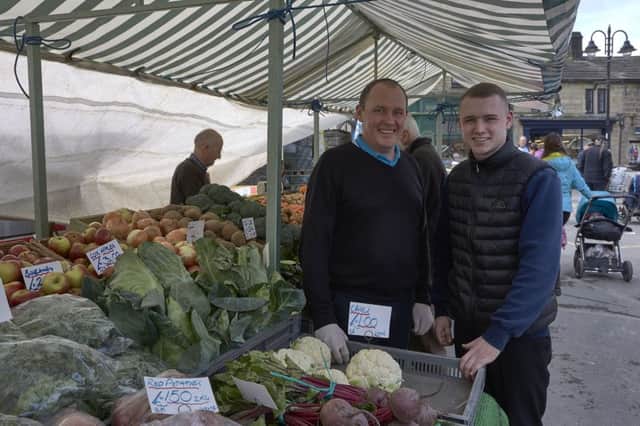 Hebden Bridge Market. Nick and Laurence Walker at their fruit and veg stall.