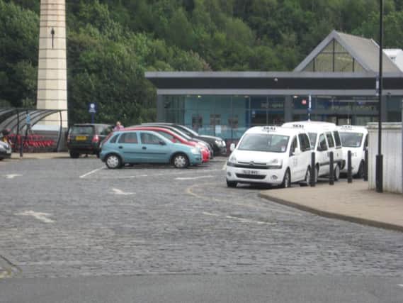 View of the train station car park, taxi rank and exterior at Halifax Railway Station