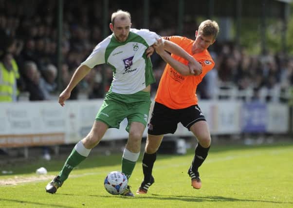 Josh Langley of AFC Fylde battles for the ball with Tom Denton of North Ferriby United - North Ferriby United vs AFC Fylde - Vanarama National League North Play-Off Final match at Grange Lane, North Ferriby,