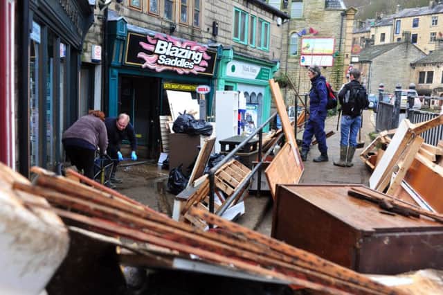 29 December 2015.......   Businesses busy cleaning up in Hebden Bridge ater serious flooding in the town.  Picture Tony Johnson