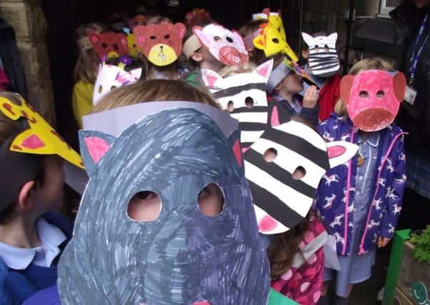 Hebden Royd pupils put on their animal maskes and searched for endangered species in Ragley Woods