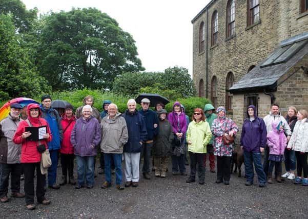 Walk: Guide Mary Twentyman (left) with the group of 25 who took part in the heritage walk