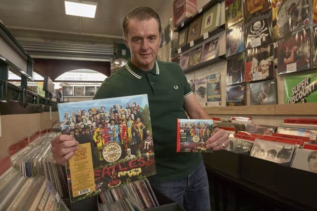 Nick Simonet, at Revo Records, Halifax,  with Sgt Pepper LP.