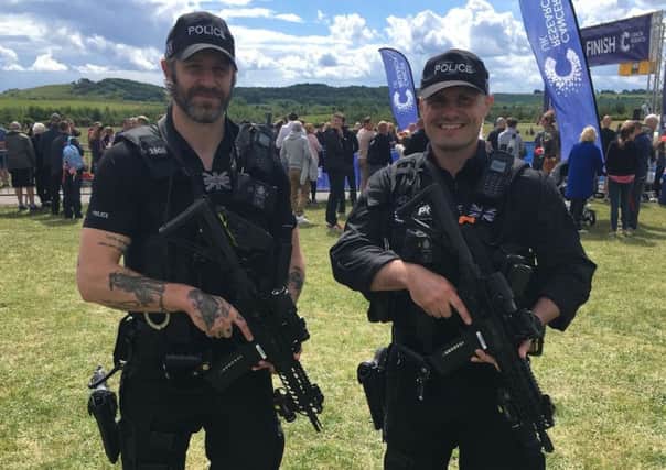 Armed police officers.