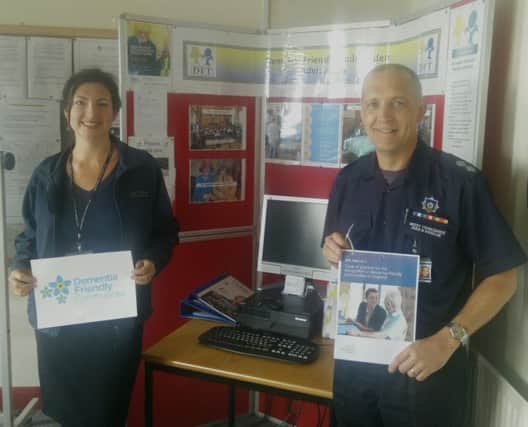 Dementia Friendly Todmorden members Lisa Candlin and watch commander Geoff Shaw at the community hub at Todmorden Fire Station