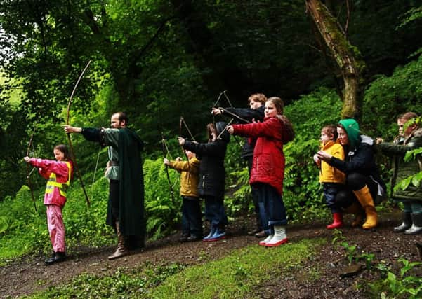 Take aim: The Sheriff of Nottingham leads the archery lessons