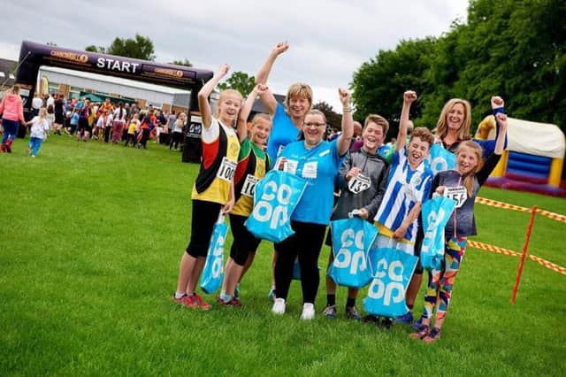 CoOp.

CoOp Hipperholme sponsors Northowarm Fun Run.

Pictured, left to right, Harriet (13), Jessica (10) & Elizabeth Cameron, Claire Willotson - Store manager, Max Whitehead (11), Sol Young (11), Scarlett Garland (10) & Alison Wilkinson.


Â© Victor De Jesus/UNP