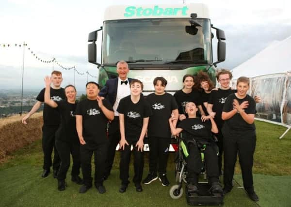 Amazing: Leo Group chairman Danny Sawrij with some the Ravenscliffe High School pupils who performed on the night