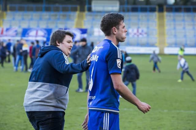 Dejected Scott McManus walks off the field after FC Halifax Town draw with Macclesfield at the Shay and lose their fight against relegation from the National League