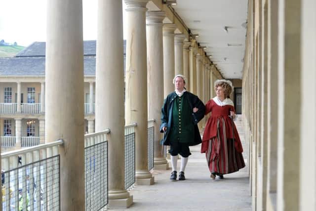 John and Jane Caygill - actors Gill Fraser-Lee and Matthew Ward - take a turn around the colonnades. Picture by Tony Johnson