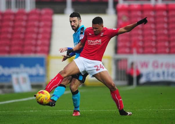Jermaine Hylton in action for Swindon (in red) who he left in the summer to join Solihull