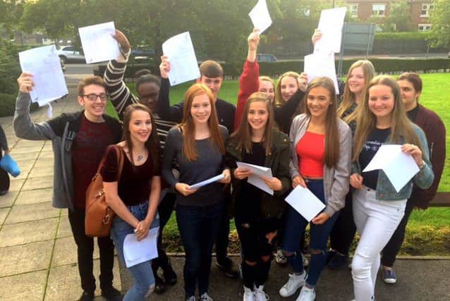 Students at Rastrick High School collect their GCSE results