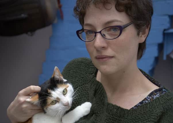 Sarah Browning with her injured cat Cluedo at their home in Lydgate, Todmorden.