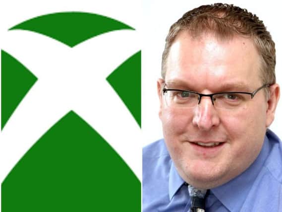 Darren Burke says the Xbox allows children to socialise in a different way.