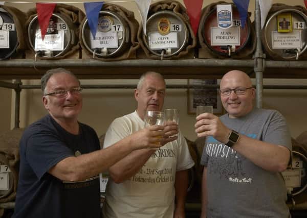 Toasting Todmorden Beer and Cider Festival success last year were Brian Hewson, Nevil Sutcliffe and Andy Griffin