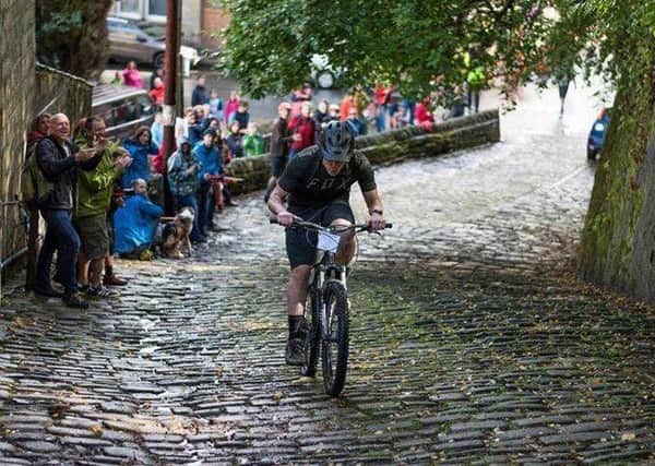 Many brave cyclists tackled the Buttress despite the rainy weather. Picture by Chris Halliwell