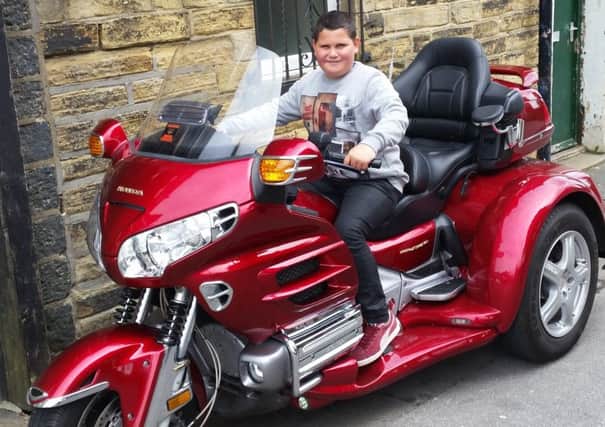 Biker: Tom was riding his Gold Wing trike (young friend pictured on it) until four months ago