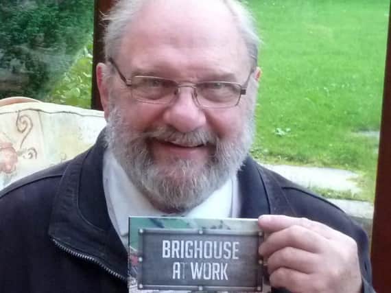 Chris Helme with his eighth book, Brighouse At Work