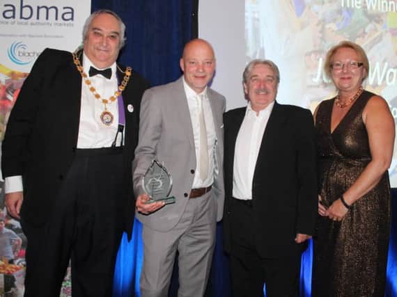 John Walker, second left, receiving his award at the NABMA annual conference.