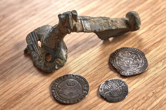 Valley: Roman brooch and coins, found at Sowerby and Luddenden