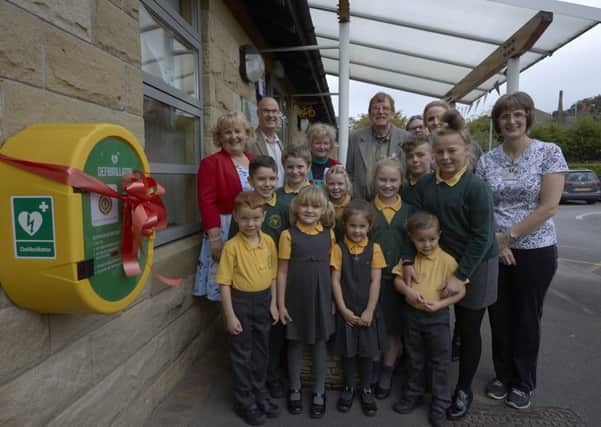 Lizzie Jones helped unveil the new defibrillator at St Patricks Catholic Primary School