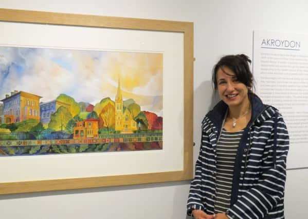 Artist Kate Lycett with her "Akroyden" painting, specially commissioned for the opening of the new gallery space at Bankfield Muszeum, Boothtown, Halifax