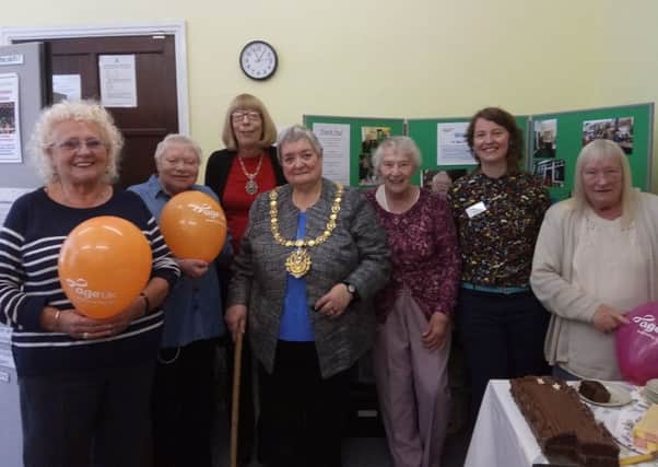 Glad to be back: Partygoers celebrate the Age UK Todmorden office re-opening