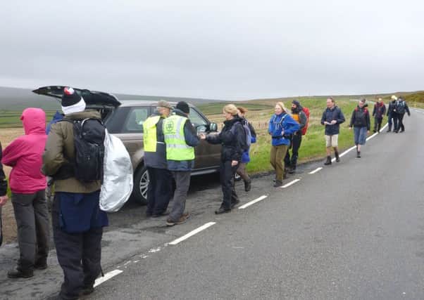Checkpoint: Taking a breather at a previous boundary walk. The club supports many local, national and international causes