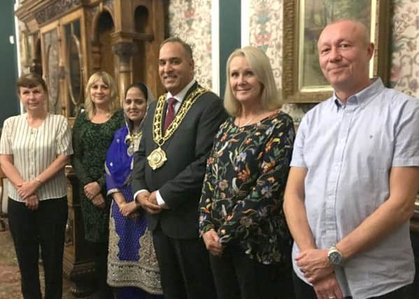 Staff receiving the Long Service Awards from the Mayor of Calderdale, Cllr Ferman Ali and the Mayoress of Calderdale, Shaheen Ali at Halifax Town Hall