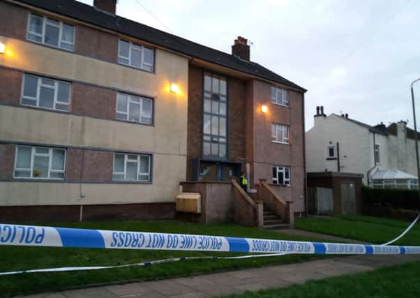 Police have cordoned off the flats at Canterbury Crescent, Boothtown