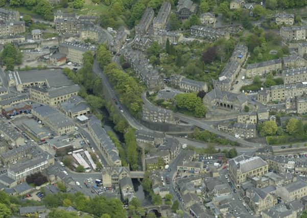 Hebden Bridge from the air, with Hebden Water running down the centre of the image. Calderdale residents and businesses in areas which have been hit by flooding are being asked to help improve the Eye On Calderdale warning and advice site