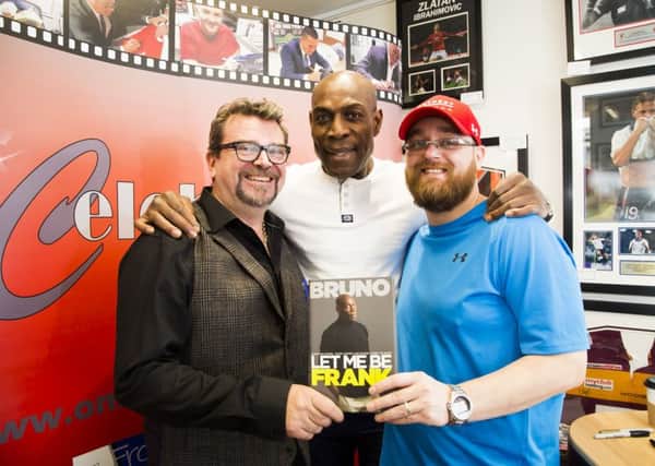 Frank Bruno, centre, at the book signing for Let Me Be Frank at Onlineauthentic Limited, Halifax Piece Hall, with Rick Berry, left, and Martin Bates, right
