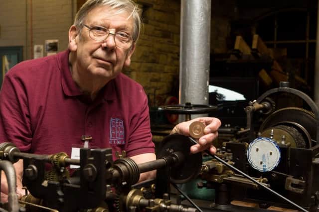 John Pickles, with the Medallion Lathe and a medal produced from it