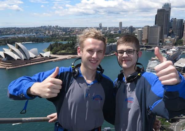 Road trip: Matt, right, and Regan, with the famous Sydney Opera House behind them