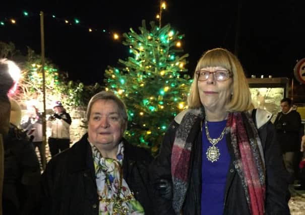 Mayor and Mayoress of Todmorden, Coun Christine Potter and Lynne Houlden, at the Walsden Christmas lights and tree switch on event