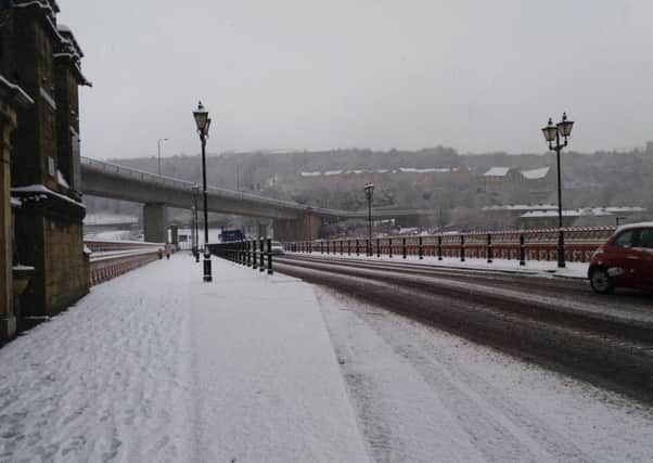 Snow sticking on the road at North Bridge, Halifax - drivers are asked to take care on Calderdale's routes