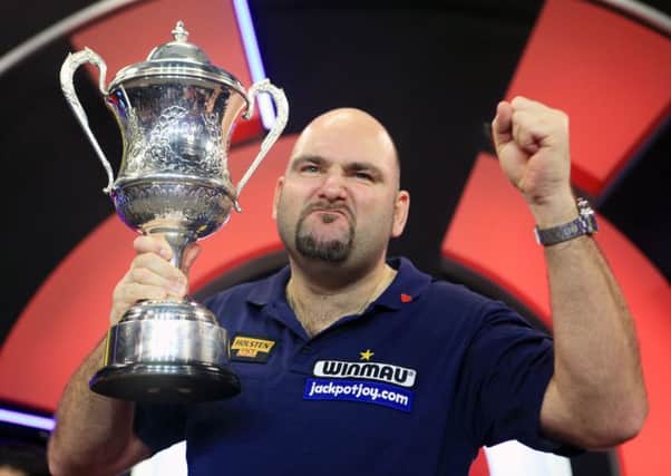 Scott Waites celebrates with the trophy during the BDO World Championship Final at the Lakeside Complex, Frimley Green. PRESS ASSOCIATION Photo. Picture date: Sunday January 10, 2016. See PA story DARTS Frimley Green. Photo credit should read: Adam Davy/PA Wire