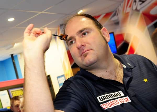 World champion darter Scott Waites takes on customers at the new Coral Bookmakers on Briercliffe Road Retail Park in Burnley.
Photo Ben Parsons