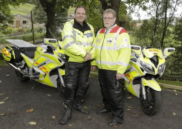Whiteknights Yorkshire Blood Bikes, West Yorkshire Manager, Andy Dickens, is pictured with Laurence Turner. Halifax-based Whiteknights Yorkshire Blood Bikes helped meet 14 calls urgent calls to transport blood and pathology samples at no cost between hospitals over Christmas