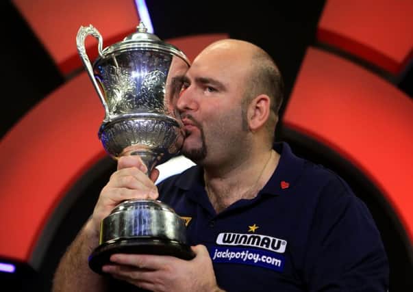 Scott Waites celebrates with the trophy during the BDO World Championship Final at the Lakeside Complex, Frimley Green. PRESS ASSOCIATION Photo. Picture date: Sunday January 10, 2016. See PA story DARTS Frimley Green. Photo credit should read: Adam Davy/PA Wire