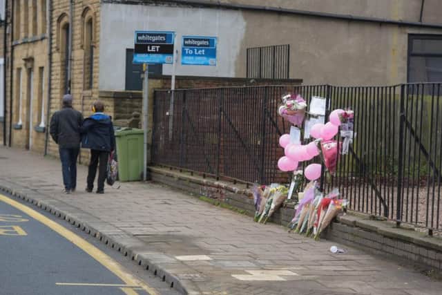 Tributes left at the scene of the crash in Huddersfield (Credit SWNS)