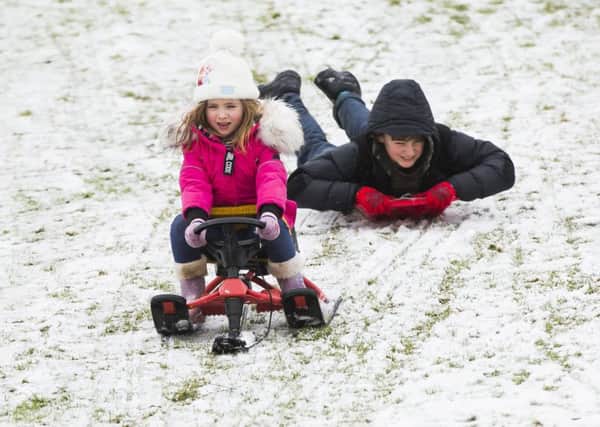 Snow - sledging at Crow Wood Park, Sowerby Bridge. Tallulah Moyneux, five, and Rafferty Parkin, 11.