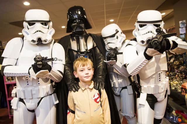 Halicon / Comicon at the MBI Shay Stadium. Rio Palmer, eight, with Darth Vader and some storm troopers.