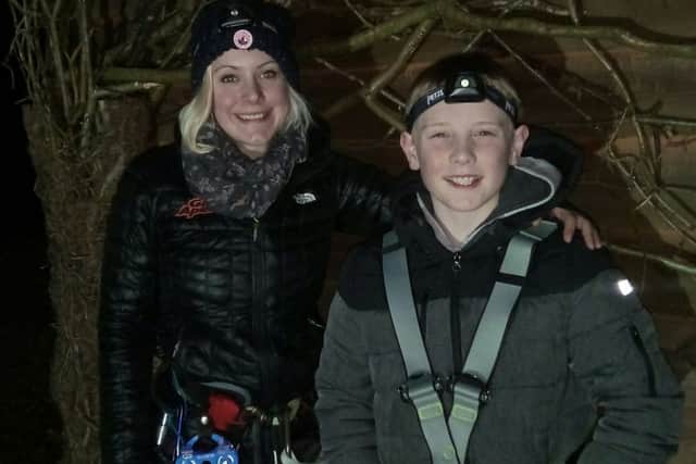 Go Ape instructor Tasmin Phillips with Jordan Atkins, 10, who sampled night-time zip wiring at Dalby Forest.