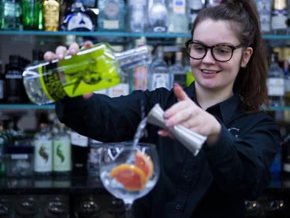 Brittany Henderson mixes a drink at Gin Lane, Halifax.